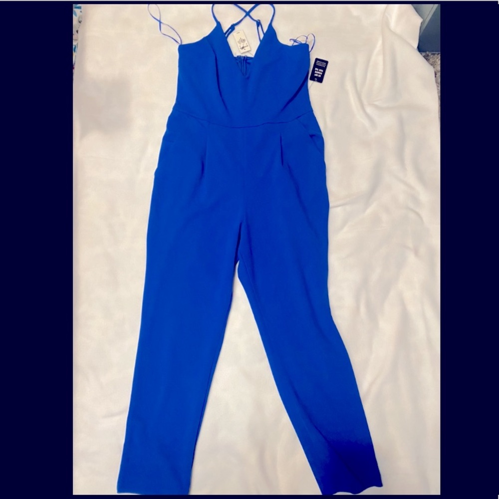NEW WITH TAGS blue jumpsuit. Size M